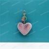 c515e6c3fe39674ef9f4691af6e37558.jpg Plush Fur Heart Shaped Keychain – Various Colours