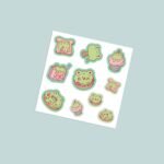 Kawaii foodie frog vinyl sticker sheet with 10 cute green frog characters with macaron donut cupcake toast and strawberry milk in soft green and pink