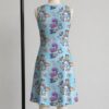 alice2-sleeveless-dress-bk1 Alice in Wonderland sleeveless dress with blue kawaii all-over print featuring Alice Cheshire Cat playing cards and Wonderland details, flowy knee length front view on mannequin