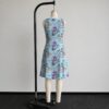 alice2-sleeveless-dress-bk2 Alice in Wonderland sleeveless dress with blue kawaii all-over print featuring Alice Cheshire Cat playing cards and Wonderland details, flowy knee length front view on mannequin
