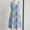 alice2-sleeveless-dress-fr1 Alice in Wonderland sleeveless dress with blue kawaii all-over print featuring Alice Cheshire Cat playing cards and Wonderland details, flowy knee length front view on mannequin