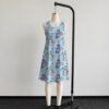 alice2-sleeveless-dress-fr2 Alice in Wonderland sleeveless dress with blue kawaii all-over print featuring Alice Cheshire Cat playing cards and Wonderland details, flowy knee length front view on mannequin