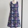 alice3-sleeveless-dress-fr1 Alice in Wonderland sleeveless dress with dark navy kawaii all-over print featuring Alice White Rabbit Cheshire Cat and Wonderland details, flowy knee length front view on mannequin