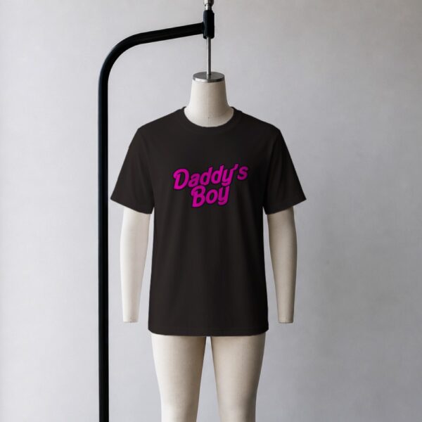 Daddy's Boy t-shirt in black with pink retro Barbie-style graphic, unisex fit, front view on mannequin