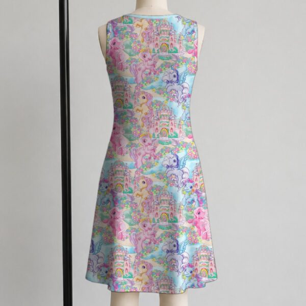 My Little Pony sleeveless dress with all-over retro G1 pony print in pastel pink blue purple and yellow, flowy knee length relaxed fit front view on mannequin
