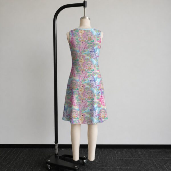 My Little Pony sleeveless dress with all-over retro G1 pony print in pastel pink blue purple and yellow, flowy knee length relaxed fit front view on mannequin
