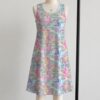 My Little Pony sleeveless dress with all-over retro G1 pony print in pastel pink blue purple and yellow, flowy knee length relaxed fit front view on mannequin