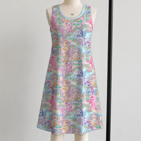 My Little Pony sleeveless dress with all-over retro G1 pony print in pastel pink blue purple and yellow, flowy knee length relaxed fit front view on mannequin