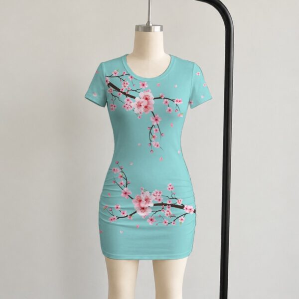 Cherry blossom bodycon dress in mint green with pink sakura floral print, short sleeve mini dress front view