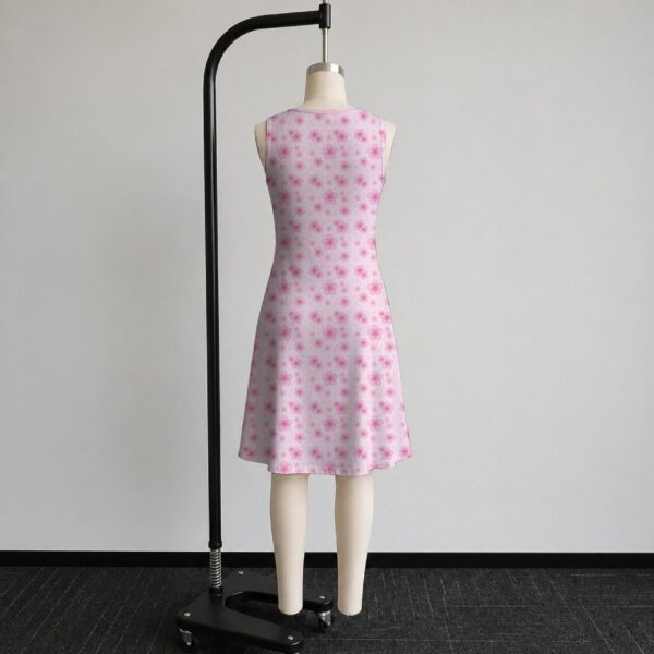 Pink sakura cherry blossom sleeveless dress with all-over pink floral print and sparkle details on pale pink background, flowy knee length front view on mannequin