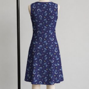 Dragonair Pokemon sleeveless dress with all-over print of Dragonair on deep navy background with white stars and pastel colour orbs, flowy knee length front view on mannequin