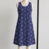 sleeveless-dress-dragonair-fr1 Dragonair Pokemon sleeveless dress with all-over print of Dragonair on deep navy background with white stars and pastel colour orbs, flowy knee length front view on mannequin