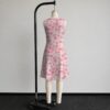 strawberry-daisy-sleeveless-dress-bk2 Pink strawberry daisy sleeveless dress with all-over print of strawberries daisies and butterflies on soft pink background, flowy knee length front view on mannequin