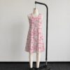 strawberry-daisy-sleeveless-dress-fr1 Pink strawberry daisy sleeveless dress with all-over print of strawberries daisies and butterflies on soft pink background, flowy knee length front view on mannequin