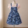 camoblue-overalls-dress-fr Navy blue camo skirt overalls dress with adjustable straps and midi length skirt, all-over camouflage print