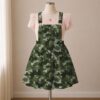 Olive green camo skirt overalls dress with adjustable straps and midi length skirt, all-over camouflage print