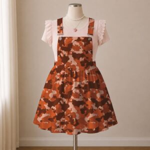camoorange-overalls-dress-fr Orange and brown camo skirt overalls dress with adjustable straps and midi length skirt, all-over camouflage print