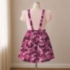 Pink magenta camo skirt overalls dress with adjustable straps and midi length skirt, all-over camouflage print