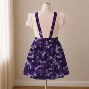 Purple camo skirt overalls dress with adjustable straps and midi length skirt, all-over camouflage print