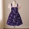 Purple camo skirt overalls dress with adjustable straps and midi length skirt, all-over camouflage print