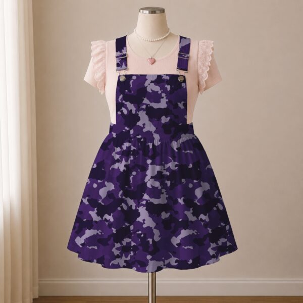 Purple camo skirt overalls dress with adjustable straps and midi length skirt, all-over camouflage print