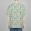 chicorita-dropsleeve-tshirt-bk Chikorita Pokemon drop shoulder t-shirt with all-over watercolour print of Chikorita on soft green and white background, unisex oversized fit