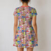 Strawberry Shortcake retro character print sundress worn by model, short sleeve flowy above knee fit with pink neckline trim