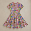 Strawberry Shortcake all-over print flowy sundress with short sleeves and pink round neck trim, retro cartoon character print