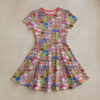 Strawberry Shortcake all-over print flowy sundress with short sleeves and pink round neck trim, retro cartoon character print