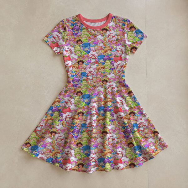 Strawberry Shortcake all-over print flowy sundress with short sleeves and pink round neck trim, retro cartoon character print