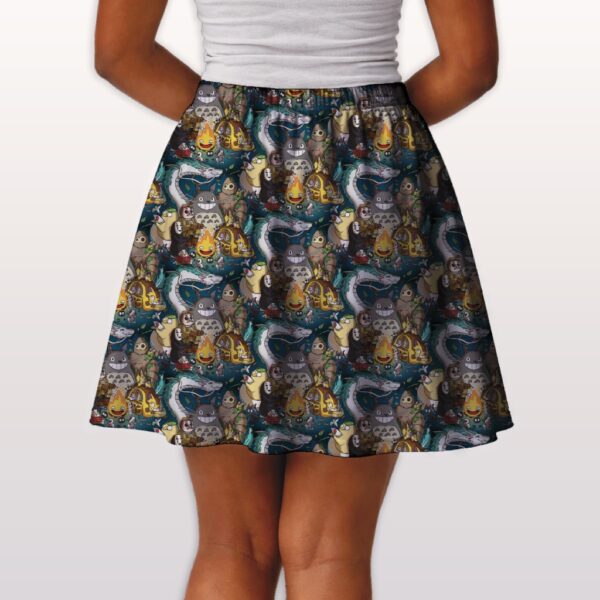 Studio Ghibli skater skirt with all-over print of Totoro Calcifer No Face Haku and Soot Sprites on rich teal background with side pockets worn by model