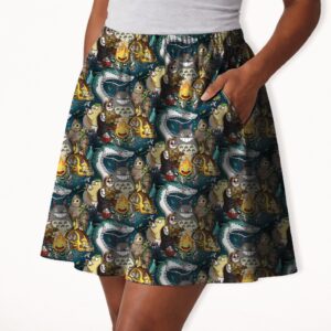 ghiblimix-skirt-pocket Studio Ghibli skater skirt with all-over print of Totoro Calcifer No Face Haku and Soot Sprites on rich teal background with side pockets worn by model