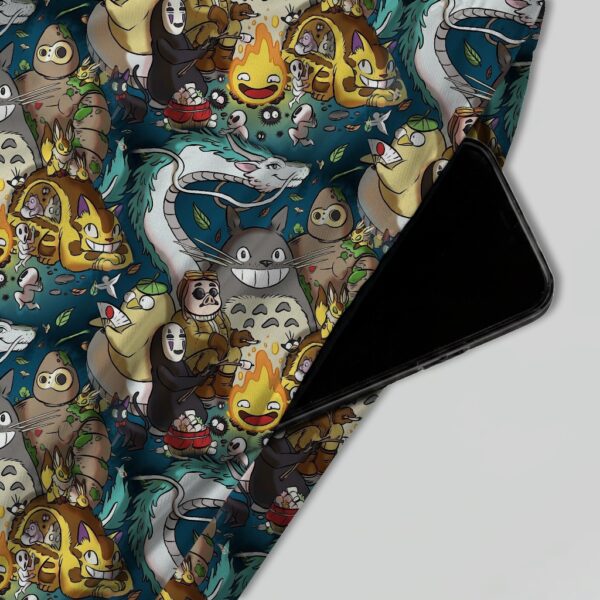 Studio Ghibli skater skirt with all-over print of Totoro Calcifer No Face Haku and Soot Sprites on rich teal background with side pockets
