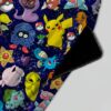 Pokemon skater skirt with all-over print of Pikachu Charmander Bulbasaur and Pokemon characters on navy galaxy background with side pockets