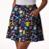 Pokemon skater skirt with all-over print of Pikachu Charmander Bulbasaur and Pokemon characters on navy galaxy background with side pockets, worn by model