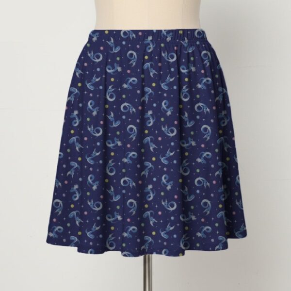 skirt-front-dragonair Dragonair Pokemon skater skirt with all-over print of Dragonair on deep navy background with white stars and pastel orbs, side pockets,