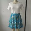 aliceblue-skirt1 Sky blue skater skirt featuring Alice in Wonderland in a daisy field with functional side pockets
