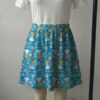 aliceblue-skirt2 Sky blue skater skirt featuring Alice in Wonderland in a daisy field with functional side pockets