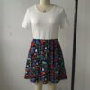 Dark navy skater skirt printed with Alice in Wonderland among red roses and deep side pockets
