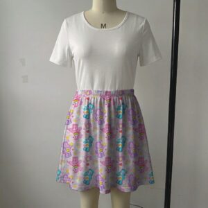 Pastel pink skater skirt printed with Care Bears, rainbows, and side pockets