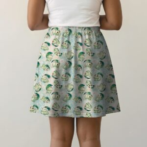 Pokemon skater skirt with all-over print of Chikorita Pokemon with side pockets, worn by model
