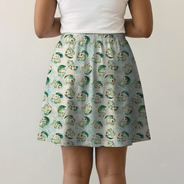 chikorita-skirt-bk Pokemon skater skirt with all-over print of Chikorita Pokemon with side pockets, worn by model