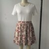 eeveexmas-skirt1 Pastel pink skater skirt printed with Christmas Eevees wearing Santa hats featuring side pockets