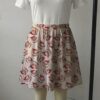 eeveexmas-skirt2 Pastel pink skater skirt printed with Christmas Eevees wearing Santa hats featuring side pockets