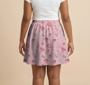 Pokemon skater skirt with all-over print of fairy type Pokemon with side pockets, worn by model
