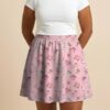 Pokemon skater skirt with all-over print of fairy type Pokemon with side pockets, worn by model