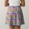 Lavender skater skirt printed with Pikachu, Eevee, Bulbasaur, flowers, and side pockets