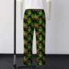 Ghostbusters Slimer skateboarding all-over print lounge pants on black background  