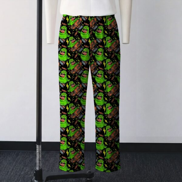 Ghostbusters Slimer skateboarding all-over print lounge pants on black background  