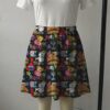 Black skater skirt printed with SpongeBob, Patrick, and Krabby Patty featuring side pockets
